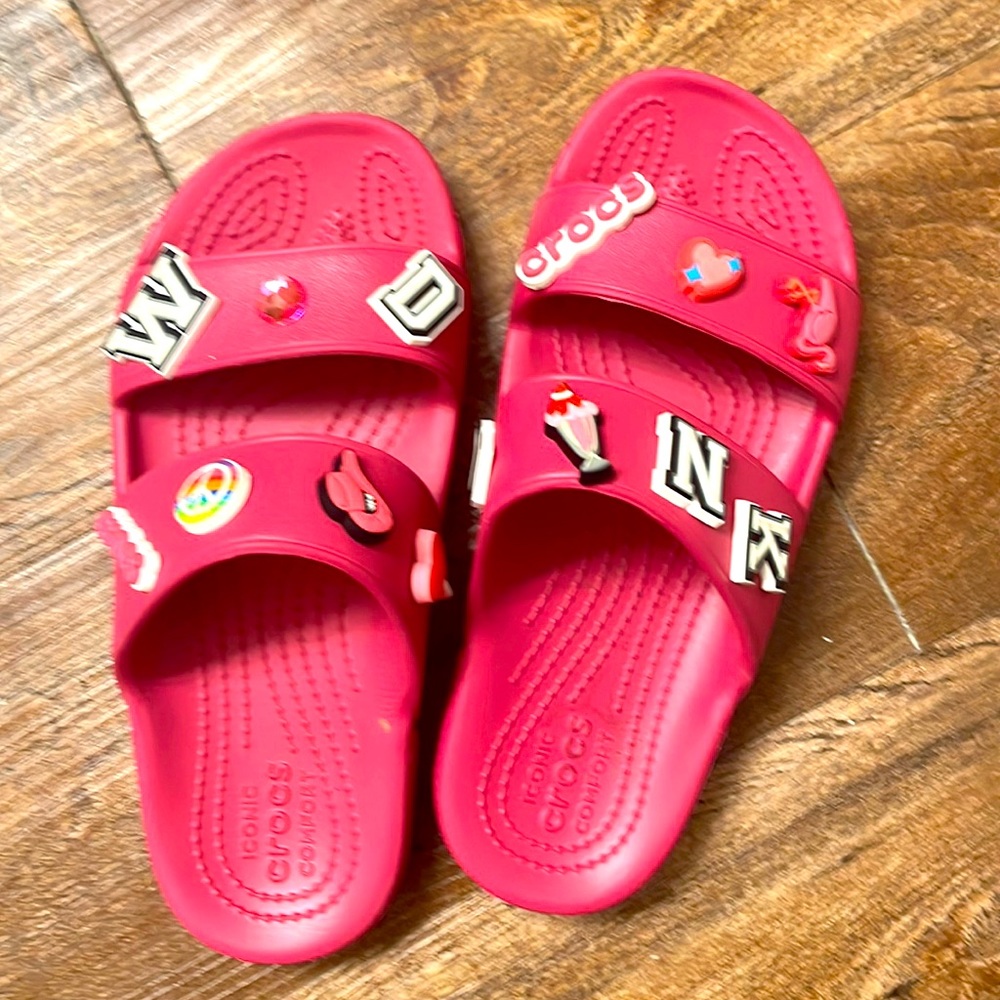 Pink Crocs slide ins